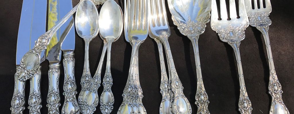 Ornate silver flatware collection